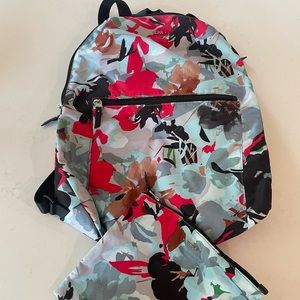 Tumi lightweight backpack with hand purse